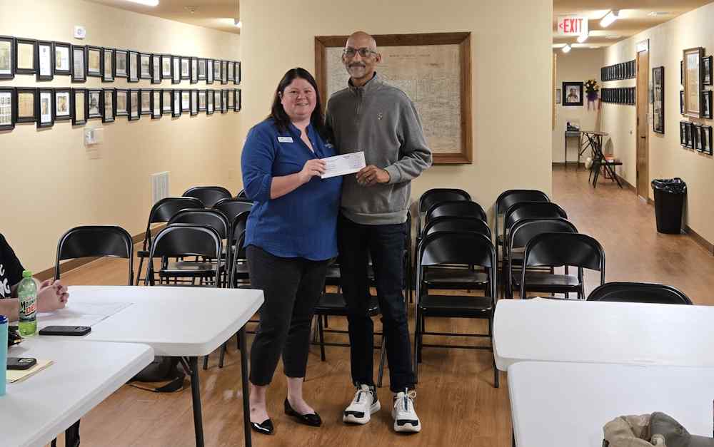 Chamber Pres Kayla Simmons presenting Fan Check to Rock Solid Robert Little Chamber Pres Kayla Simmons presenting Fan Check to Rock Solid Robert Little